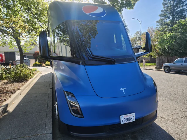 a new pepsi branded tesla semi rolled up across the street v0 cpqfo6wr7oua1